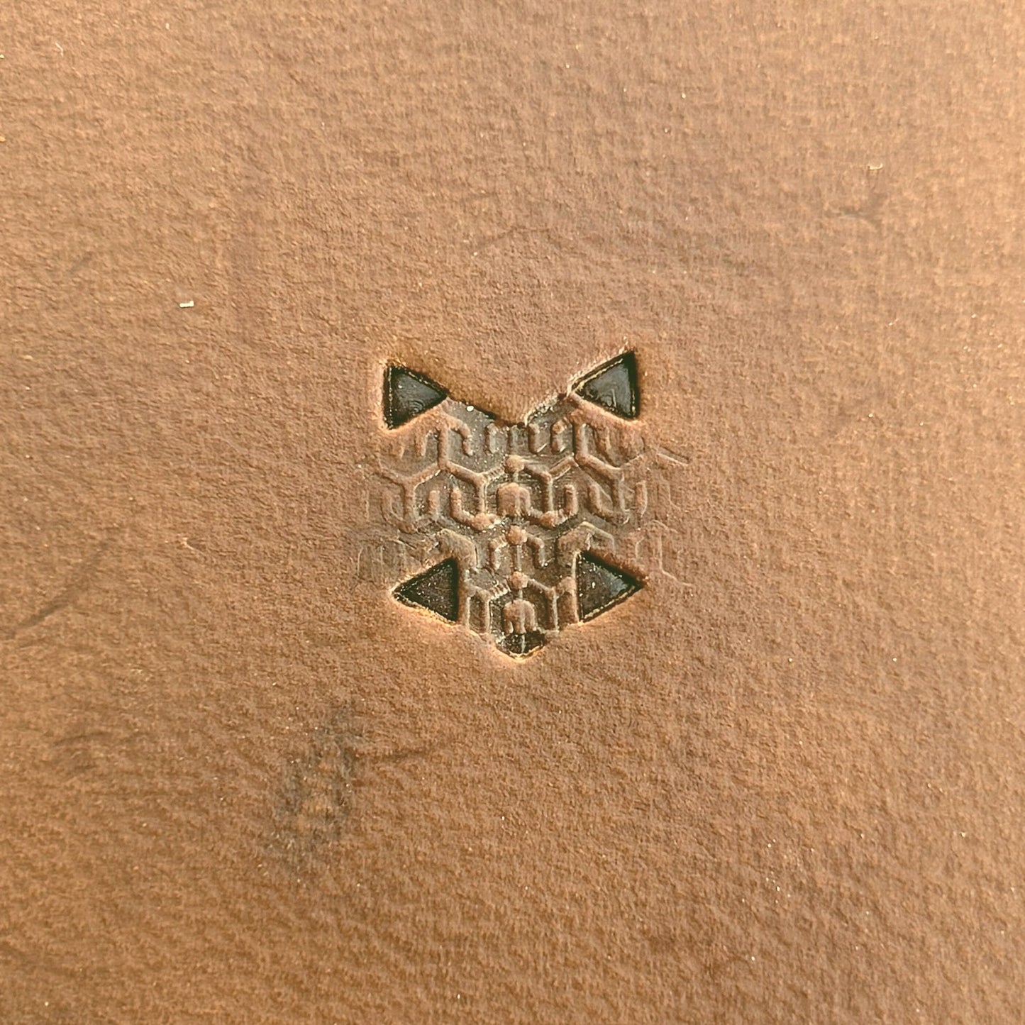Hooked Mesh Hex Tile leather stamp LT823 — single impression on veg-tan leather