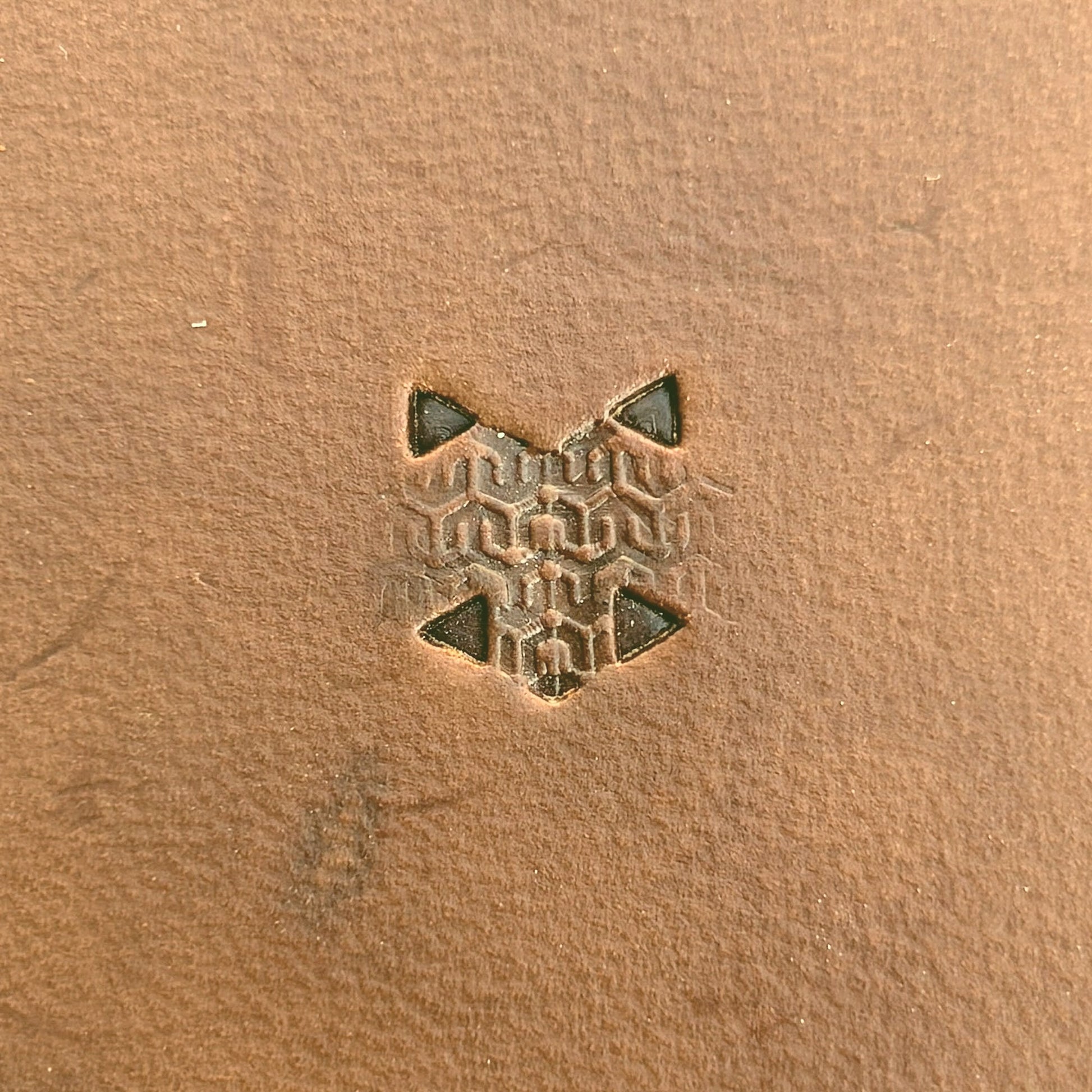 Hooked Mesh Hex Tile leather stamp LT823 — single impression on veg-tan leather