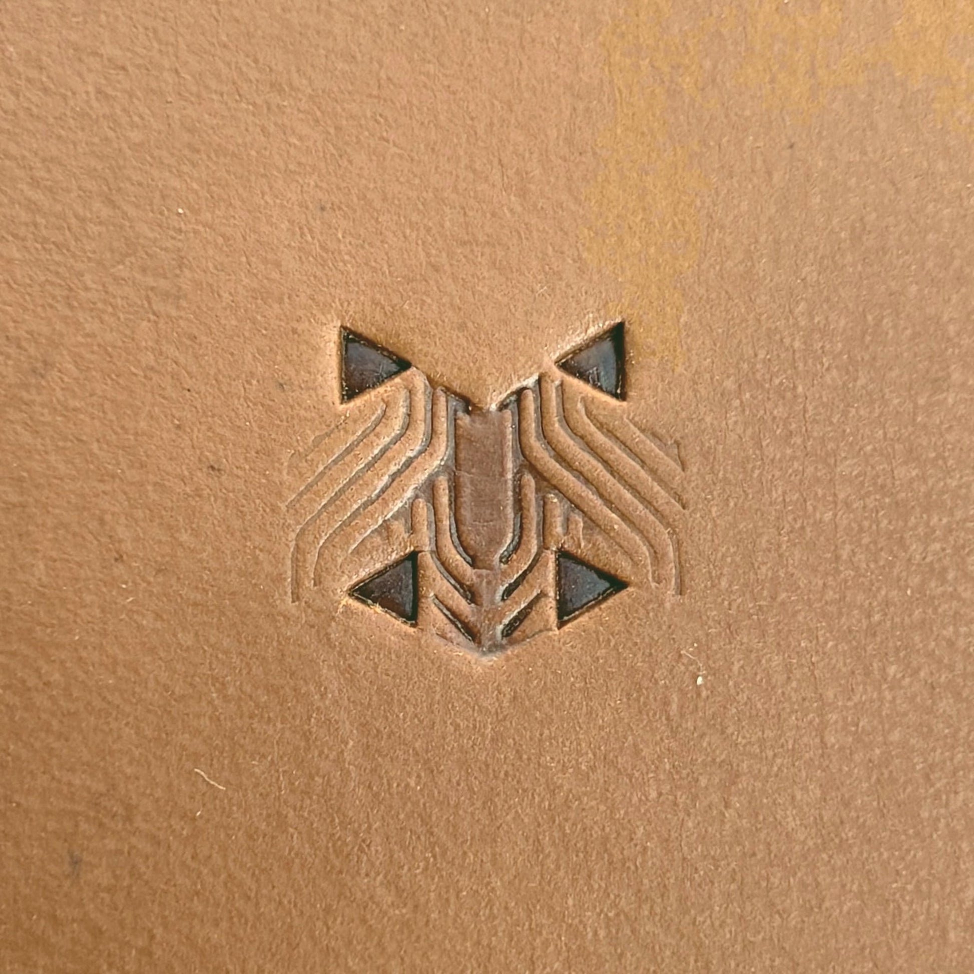 Grooved Hex Tile leather stamp LT826 — single impression on veg-tan leather
