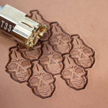 Interlocking Skulls leather stamp LT835 — pattern imprint on veg-tan leather