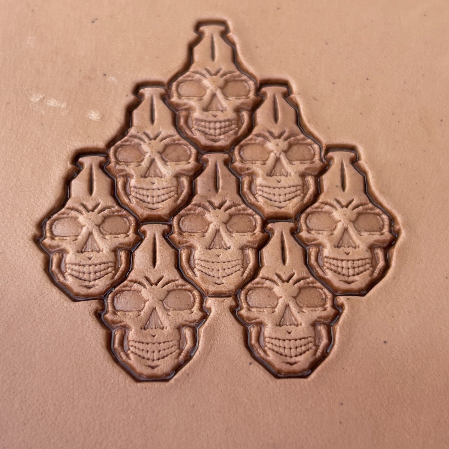 Interlocking Skulls leather stamp LT835 — pattern imprint on veg-tan leather