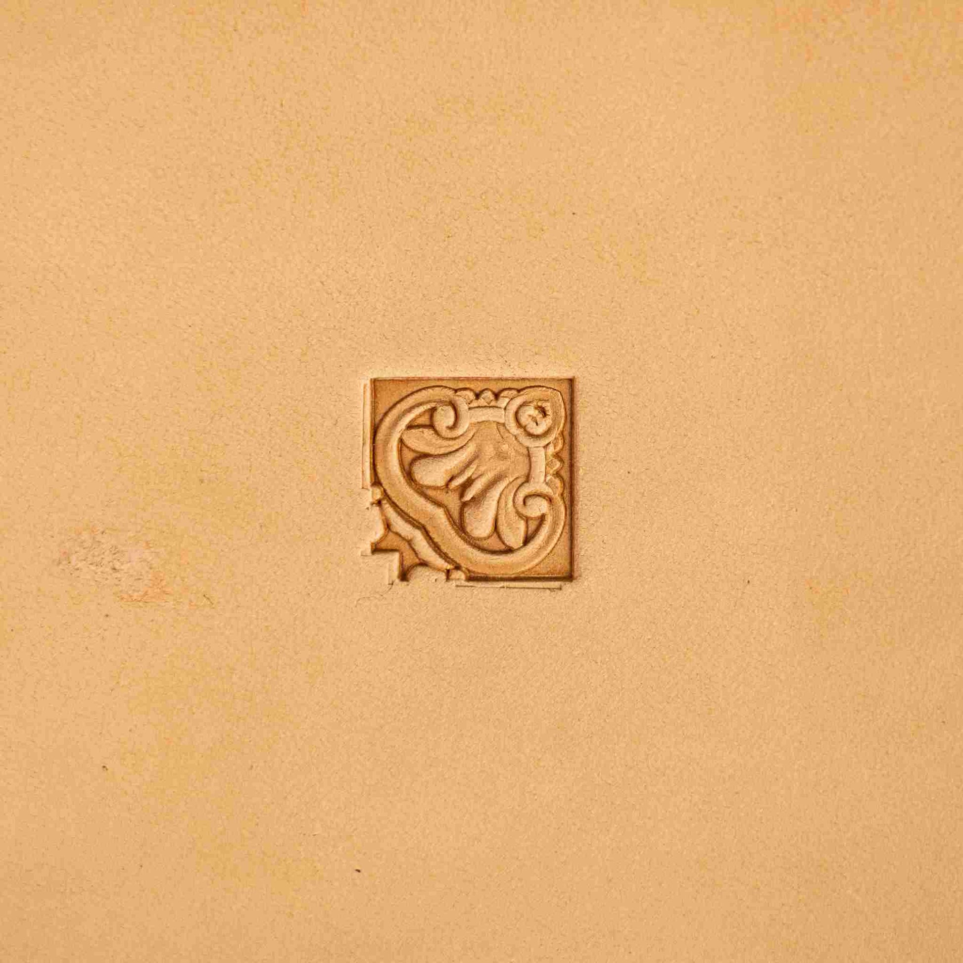 Ornate leather stamp LT146 — corner stamp impression on veg-tan leather